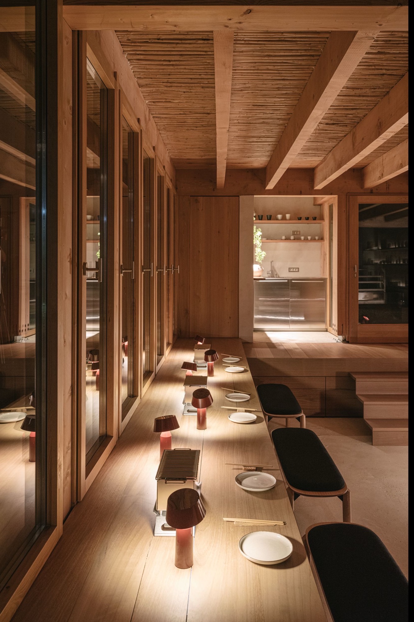 Minimalist wood-panelled restaurant dining counter