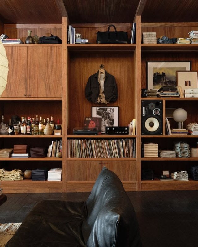 Shelves of records and books in a warm interior